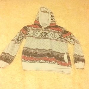 A small, patterned sweatshirt. (For teens)